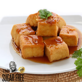 G Hughes sauce ready for dipping pork or egg rolls with a glossy sweet-sour glaze.