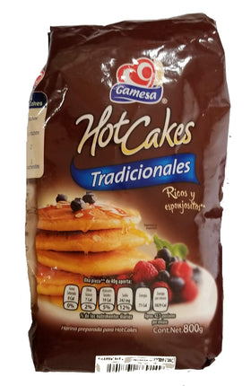 Gamesa Mexican Hot Cakes pancake mix packaging on shelf, ideal for quick breakfasts.