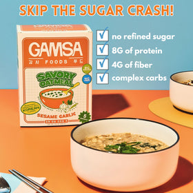 Steaming juk-inspired porridge bowl by Gamsa Foods in cozy kitchen.