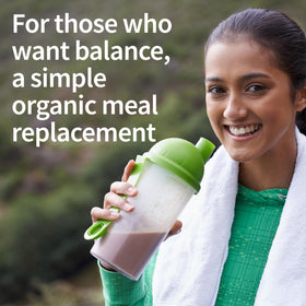Scoop beside Garden of Life Raw Organic Meal powder on a counter