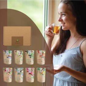Gardenika Tea Sampler displayed with glass cup for cozy tea time.