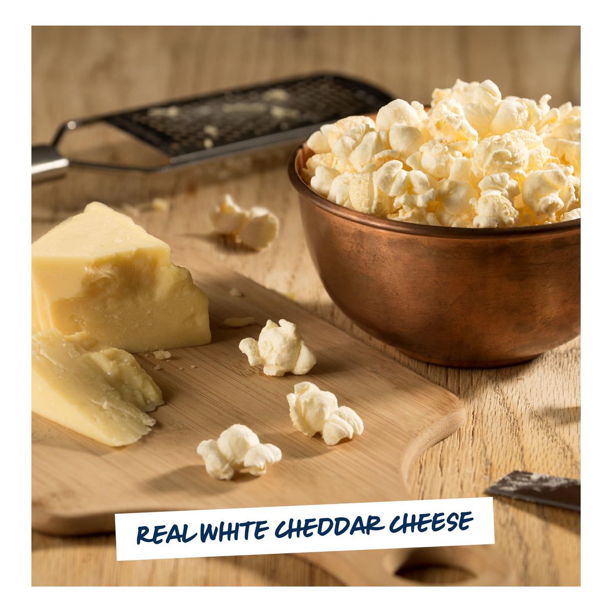 Close-up texture of Garrett Popcorn White Cheddar with cheesy crunch.