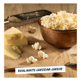 Close-up texture of Garrett Popcorn White Cheddar with cheesy crunch.