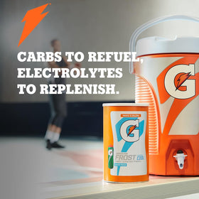 Gatorade Thirst Quencher powder lemon-lime being mixed in water for refreshing hydration