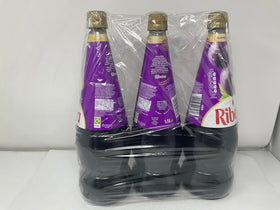 Generic blackcurrant concentrate in a glass with a refreshing drink, illustrating serving idea.