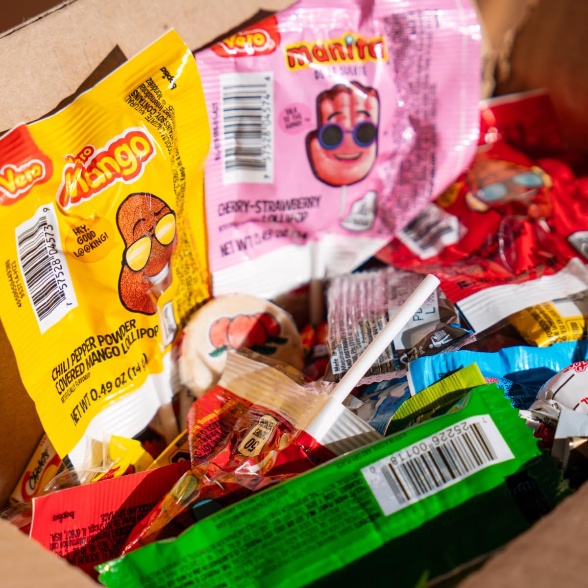 Colorful candy powder and gummies close-up for playful color