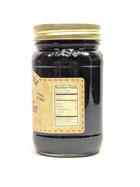 Generic Dutch Kettle blackberry jam seeded jar on pantry shelf, ideal gift-worthy appeal.
