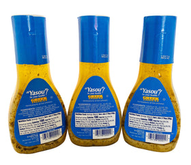 Generic Greek Dressing pouring on salad for finishing touch
