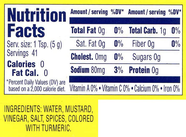 Generic hot Chinese mustard complements vegetables, rice, potstickers, and egg rolls.