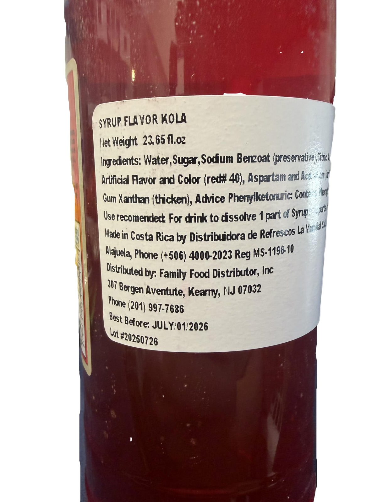 Generic Kola Syrup glass with ice enhances drinks.