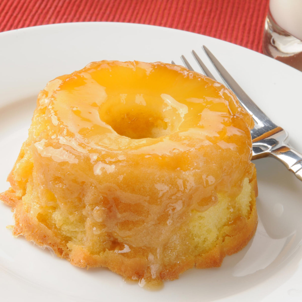 Generic Pineapple filling pouring into pastries for even distribution.