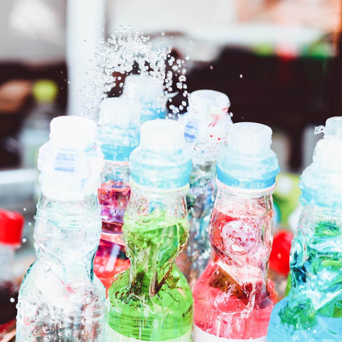 Generic Ramune strawberry bottles at a party setting, ideal for themed treats.
