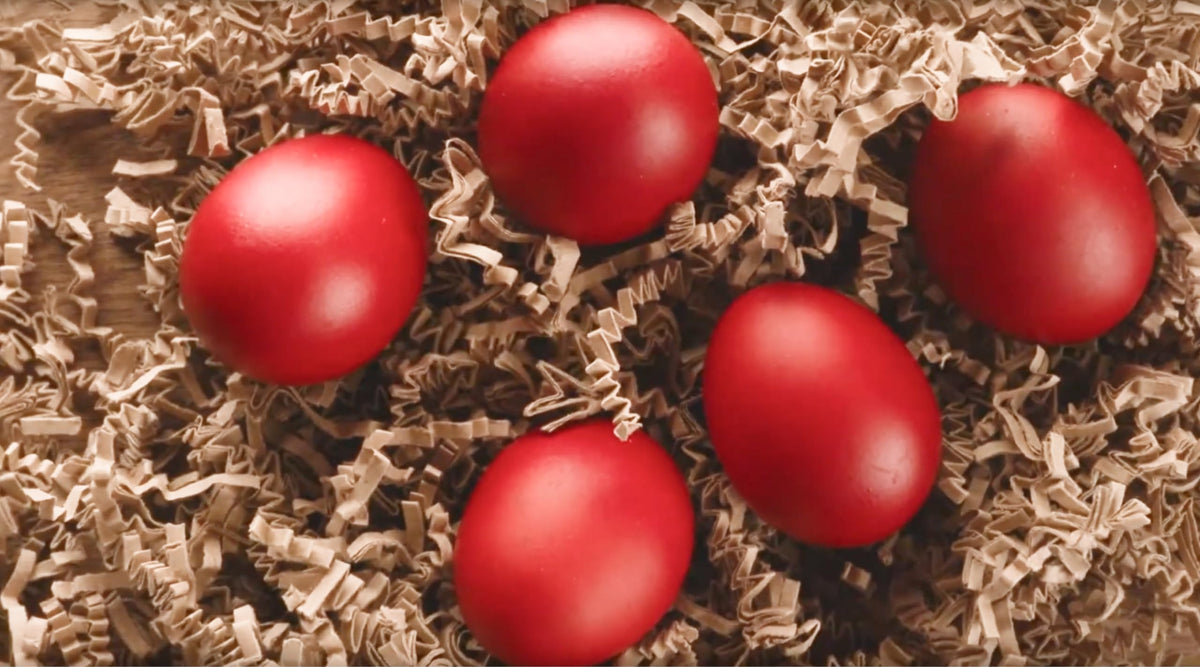 Generic Red Egg Dye dipping eggs demonstrates quick 3-5 minute coloring