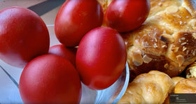 Generic red egg dye dipping eggs yields consistent, eye-catching results.
