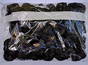 Close-up of Broadway Licorice Wheels showing chewy texture and glossy finish.