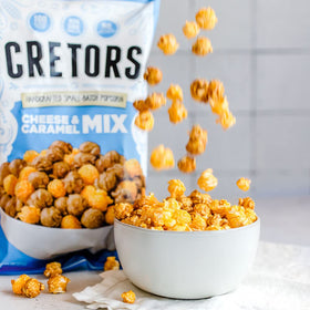 G.H. Cretors Cheese & Caramel Mix bags closeup, premium ingredients highlighted.