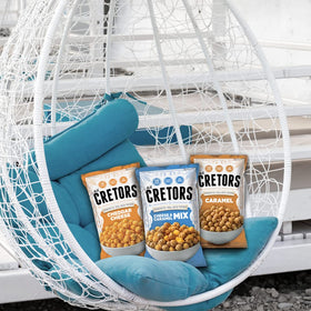 G.H. Cretors Cheese & Caramel Mix family snacking scene, versatile treat.