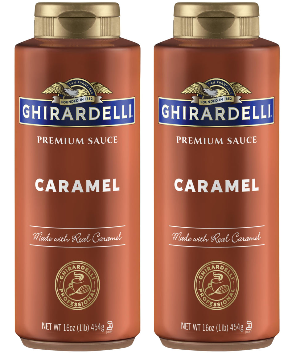 Ghirardelli caramel sauce bottles ready for topping desserts on a kitchen counter.