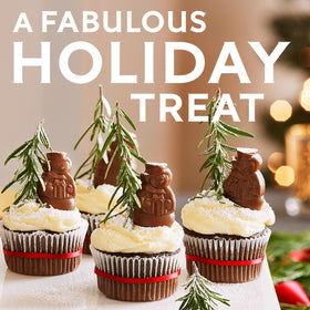 Ghirardelli Chocolate Snowmen holiday collection on a colorful display.