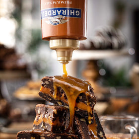 Ghirardelli caramel sauce drizzled on desserts to enhance richness.