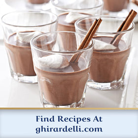Ghirardelli hot cocoa in a mug with steam for a velvety sip.