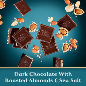 Ghirardelli Intense Dark Sea Salt Almond bar slice closeup highlighting almonds and salt.