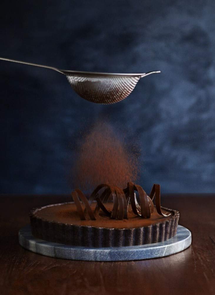 Ghirardelli Majestic Dutch Cocoa Powder close-up shows deep color and aroma