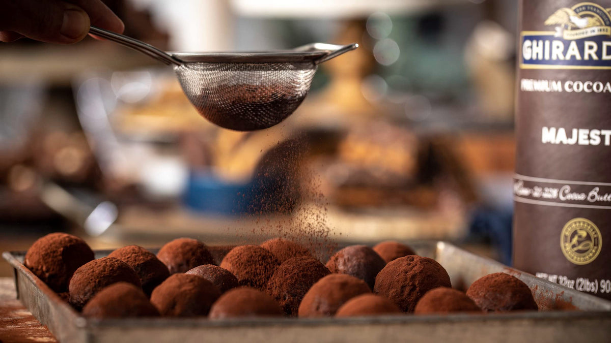 Ghirardelli Majestic Premium Cocoa Powder can close up highlighting Dutch processed richness