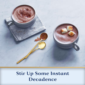Ghirardelli Mocha Hot Cocoa Mix mug with steaming beverage.