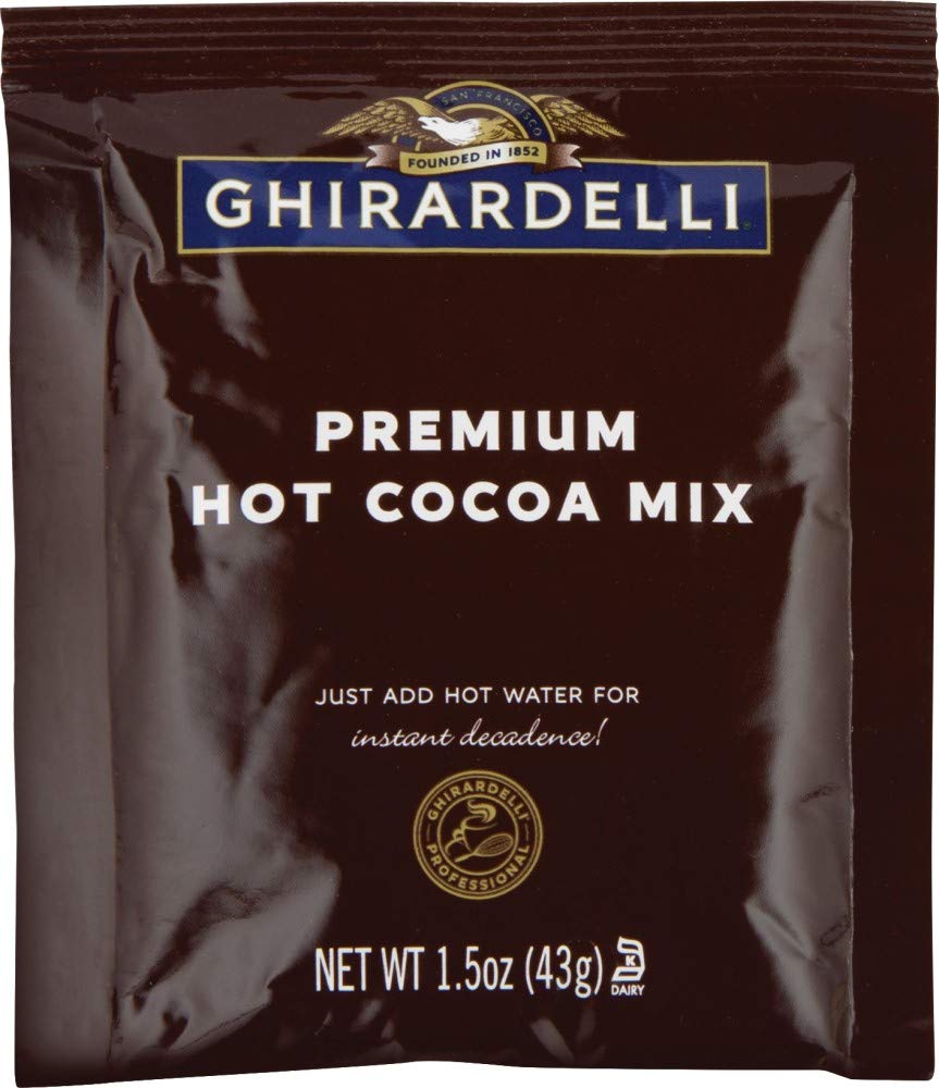Ghirardelli Premium Indulgence hot cocoa cup with steam—rich aroma in a mug.