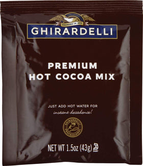 Ghirardelli Premium Indulgence hot cocoa cup with steam—rich aroma in a mug.