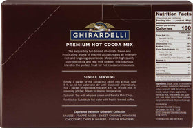 Ghirardelli hot cocoa powder close-up—creamy milk powder in the blend.