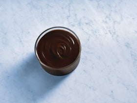 Ghirardelli premium sauce dessert topping drizzle on pastries and desserts.