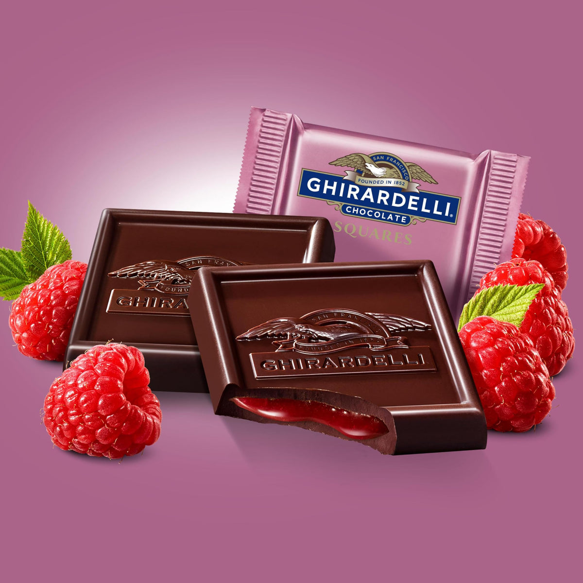 Close-up of raspberry filling inside a Ghirardelli square.