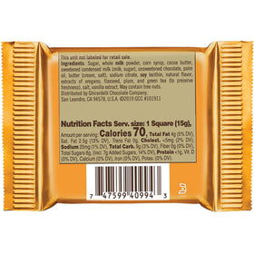Person holding Ghirardelli squares for a personal indulgence moment.