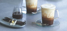 Ghirardelli Vanilla Sauce pouring into a dessert glass for a vanilla touch.