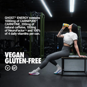 Ghost Energy Tropical Mango poured into a glass with ice for refreshing energy.