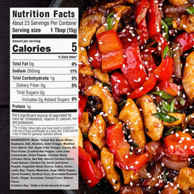 G Hughes General Tso sauce in a hot pan with vegetables for a savory stir-fry.