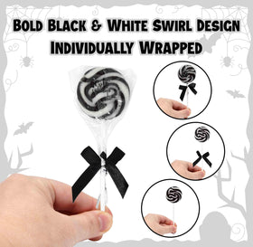 Gift Boutique lollipops with black ribbon bows for chic event presentation.
