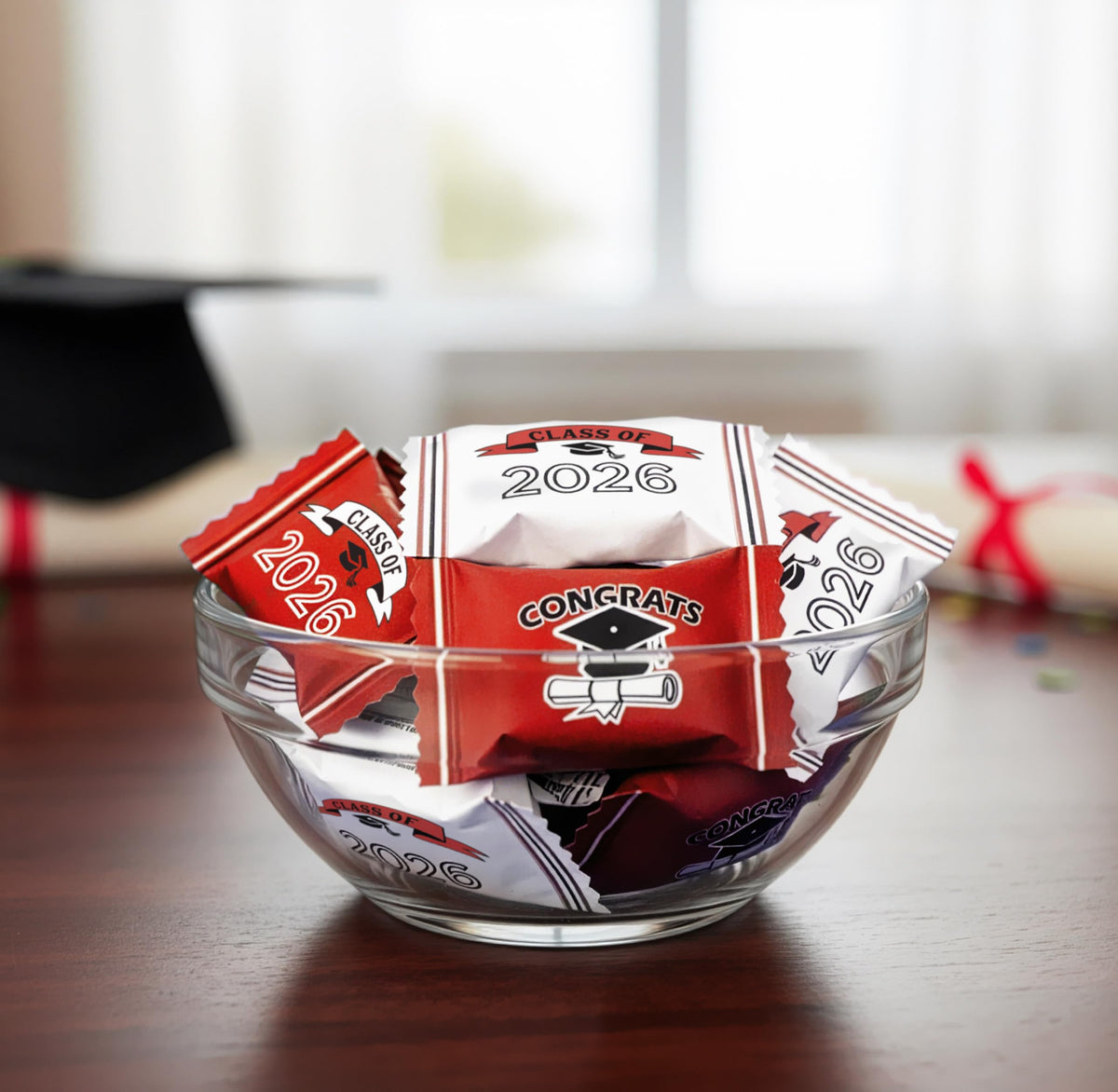 Gift Boutique red mints on a candy tray brighten graduation tables.