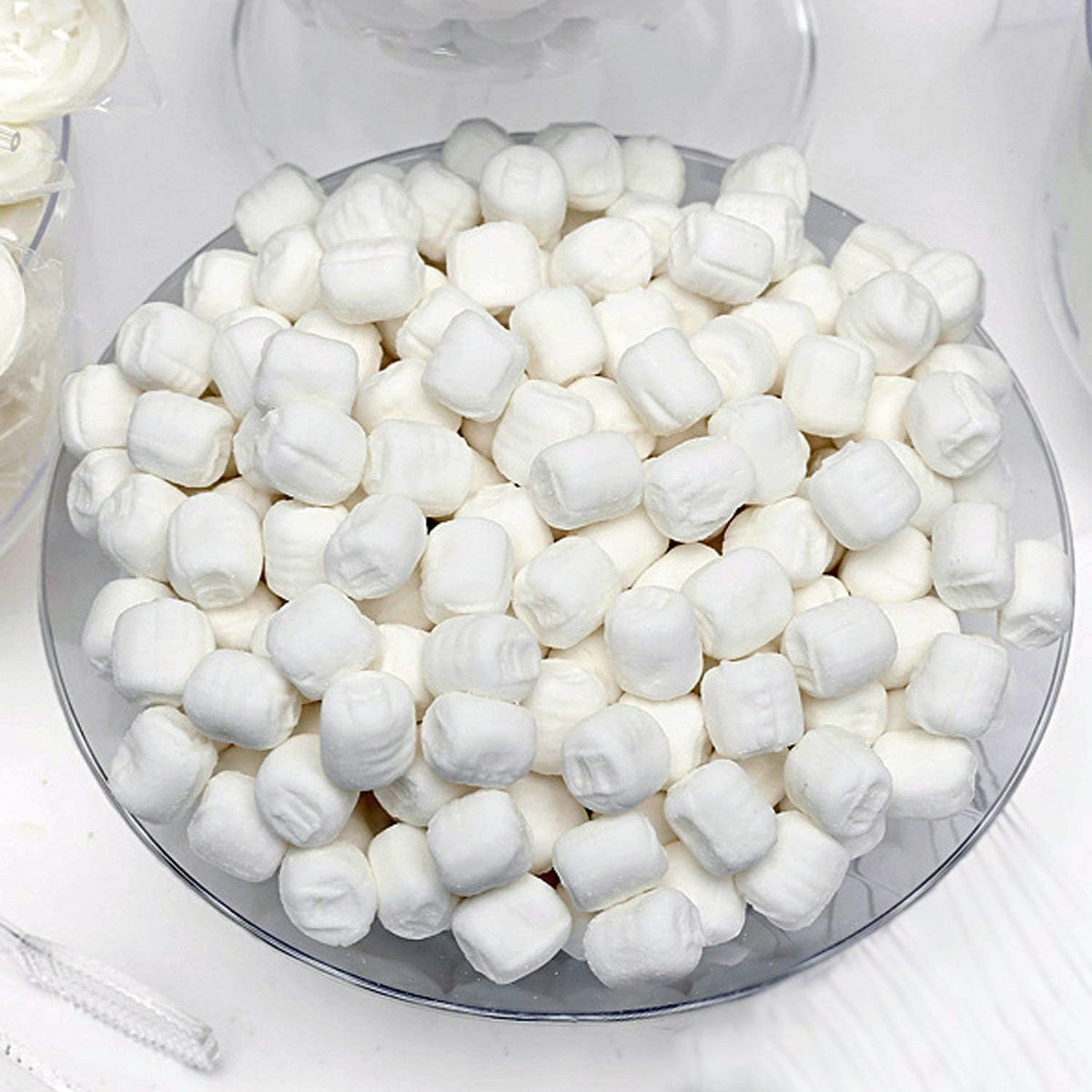 Gift Boutique pink-white-black mints in gift box for festive graduation favors.