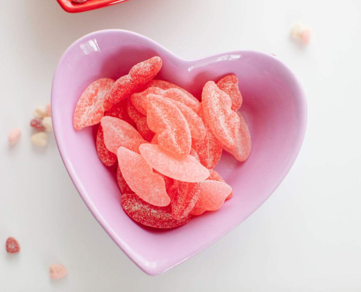 Open resealable bag maintaining freshness of Sour Pucker Lips.