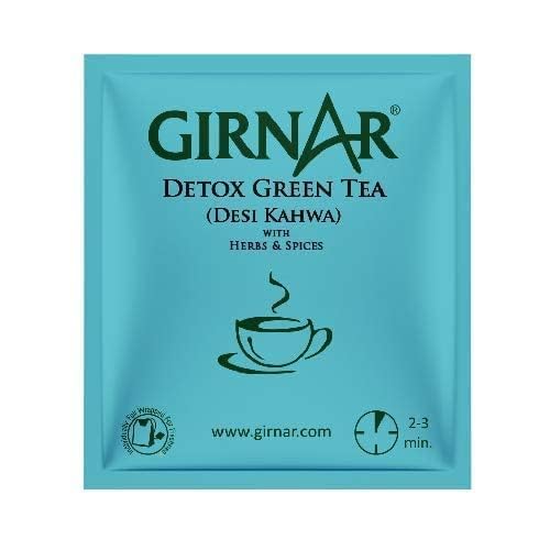 GIRNAR Desi Kahwa steeping tea in hot water creating fragrant steam.
