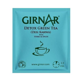 GIRNAR Desi Kahwa steeping tea in hot water creating fragrant steam.