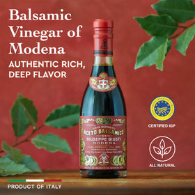 Close-up of Giusti balsamic in a glass, deep brown hue and velvety body.
