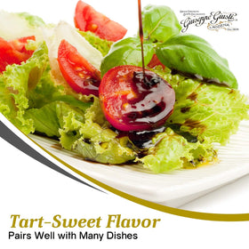 Pouring Giusti balsamic over a salad for vinaigrette enhancement