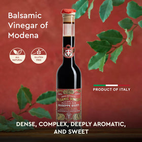Giusti balsamic vinegar deep glossy brown color enriches meats and cheeses