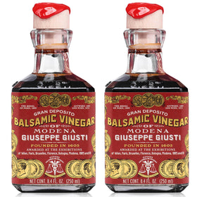 Giusti Modena IGP balsamic bottle pouring to finish salads