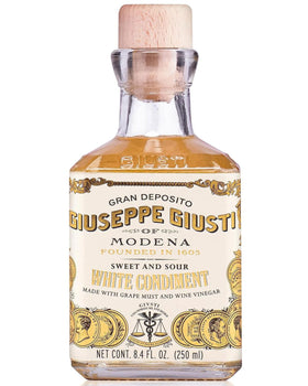 Giusti White Balsamic Vinegar Dressing bottle for versatile gourmet use.