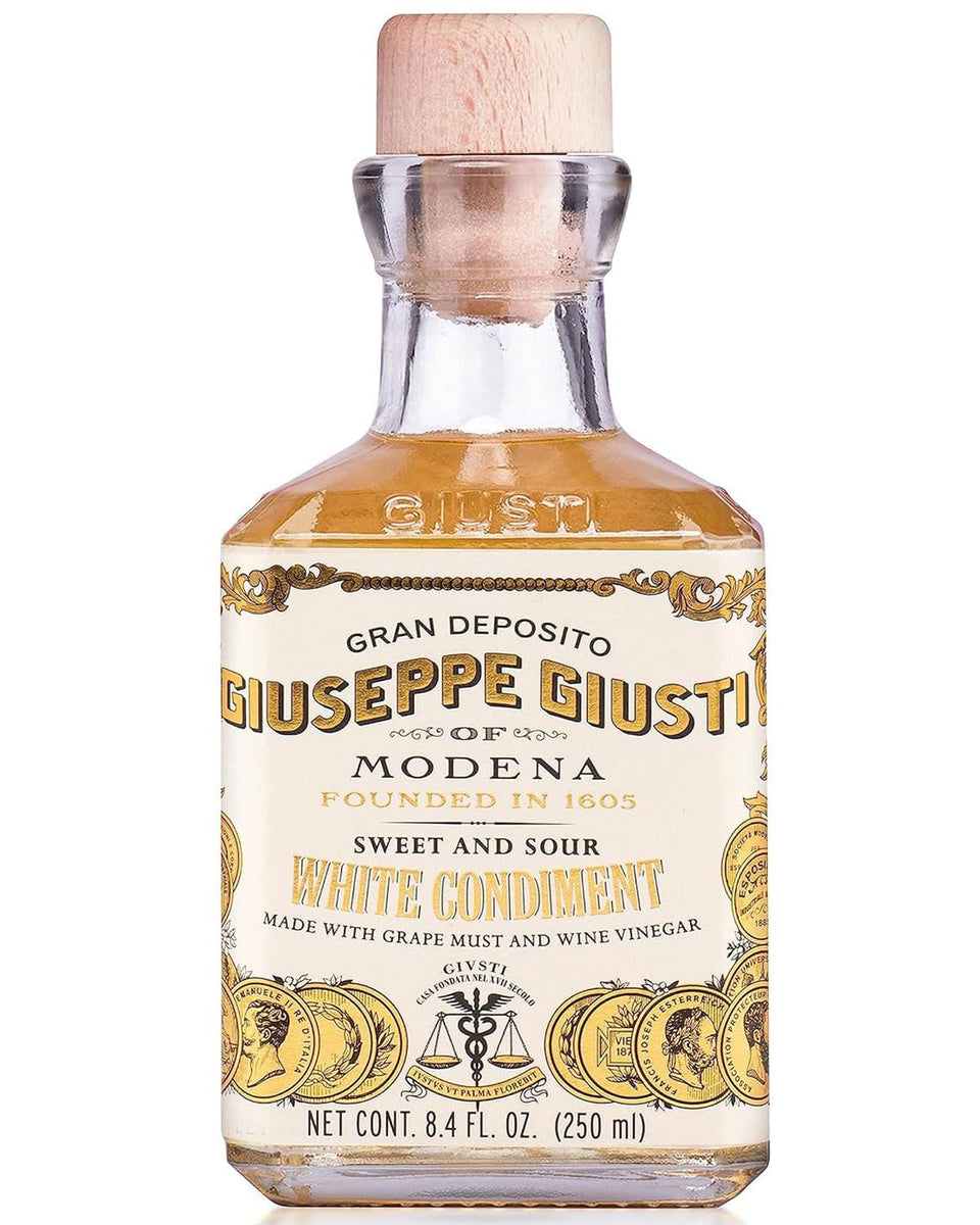 Giusti White Balsamic Vinegar Dressing bottle for versatile gourmet use.